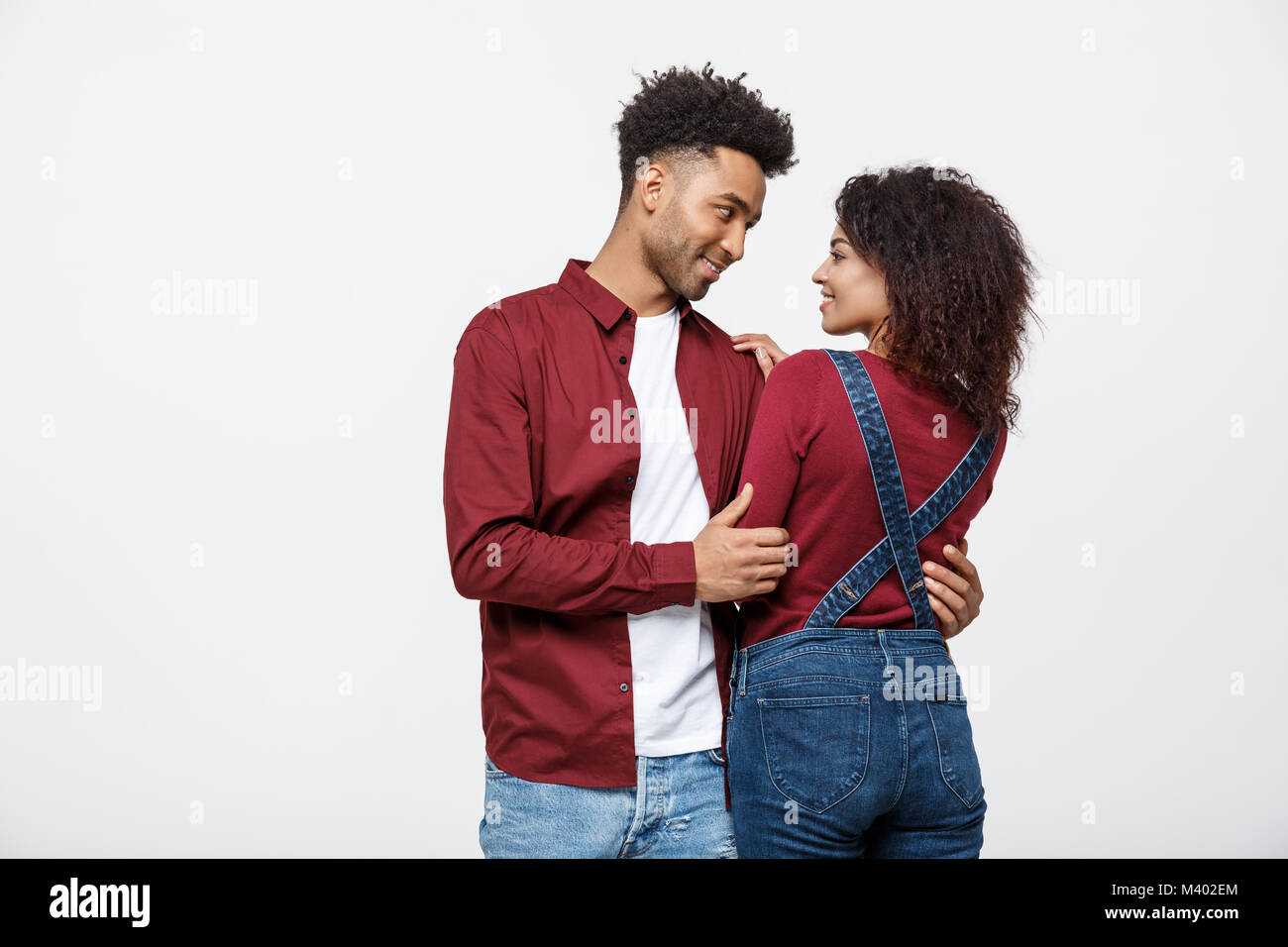 portrait of happy african american couple hug each other on white ...
