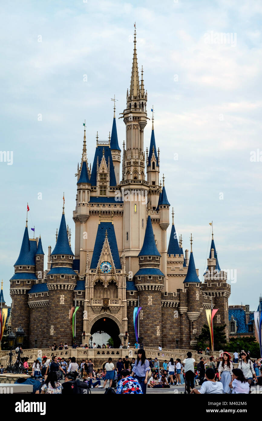 Cinderella castle at Disneyland Tokyo with crowds of people in front. Stock Photo