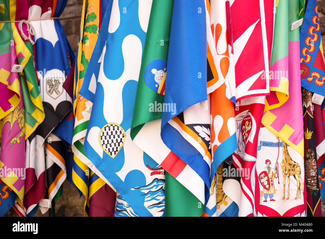Flags of the Siena contrade (districts), Palio festival background, in Siena, Tuscany, Italy Stock Photo