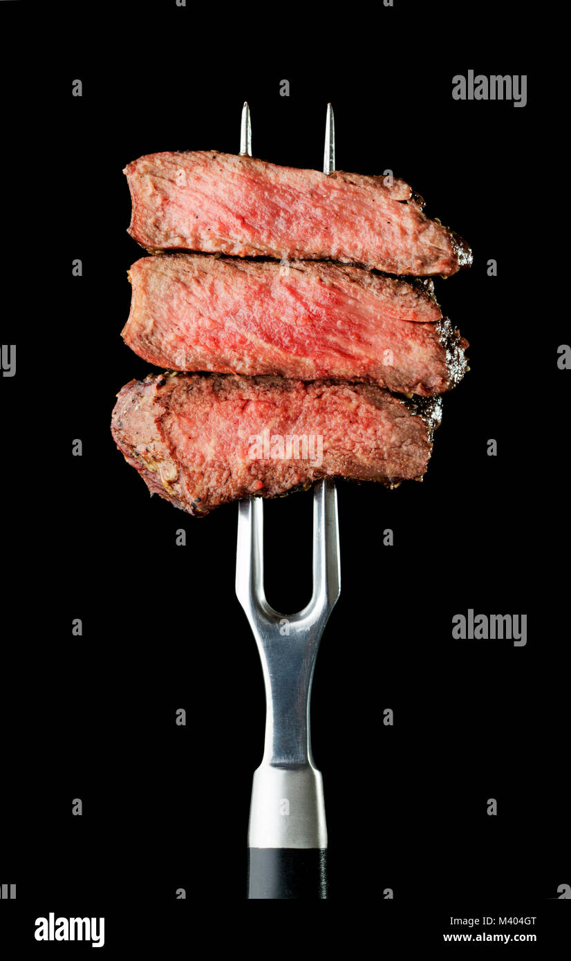 steak on fork Stock Photo Alamy