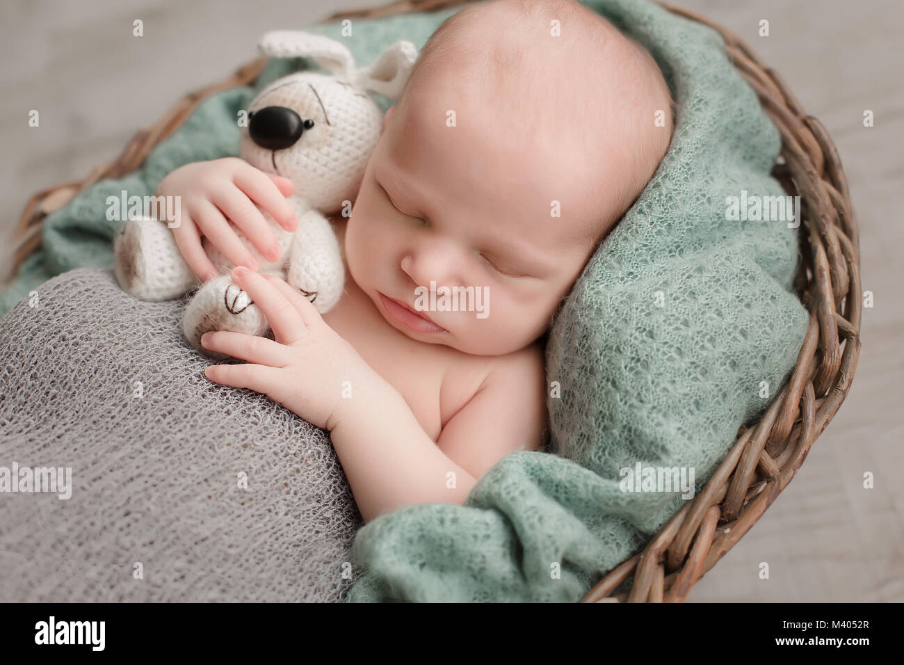 Sleeping newborn baby boy swaddled in a blanket Stock Photo Alamy