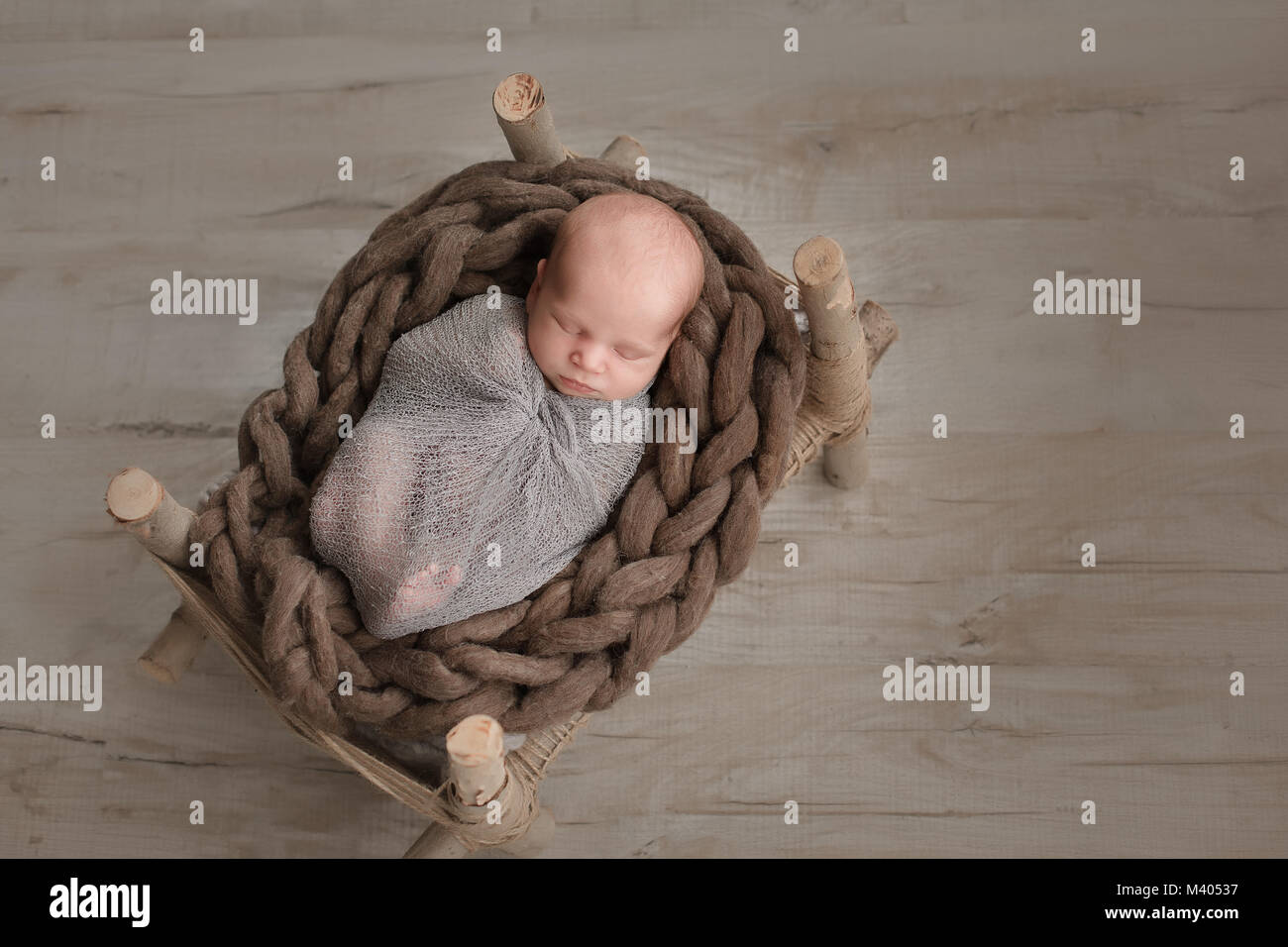 Sleeping newborn baby boy swaddled in a blanket Stock Photo Alamy