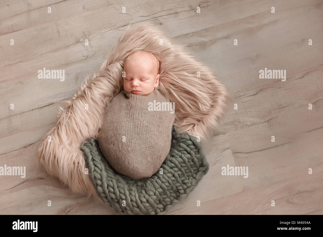 Sleeping newborn baby boy swaddled in a blanket Stock Photo Alamy