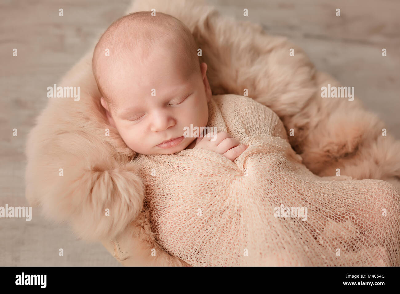 Sleeping newborn baby boy swaddled in a blanket Stock Photo Alamy