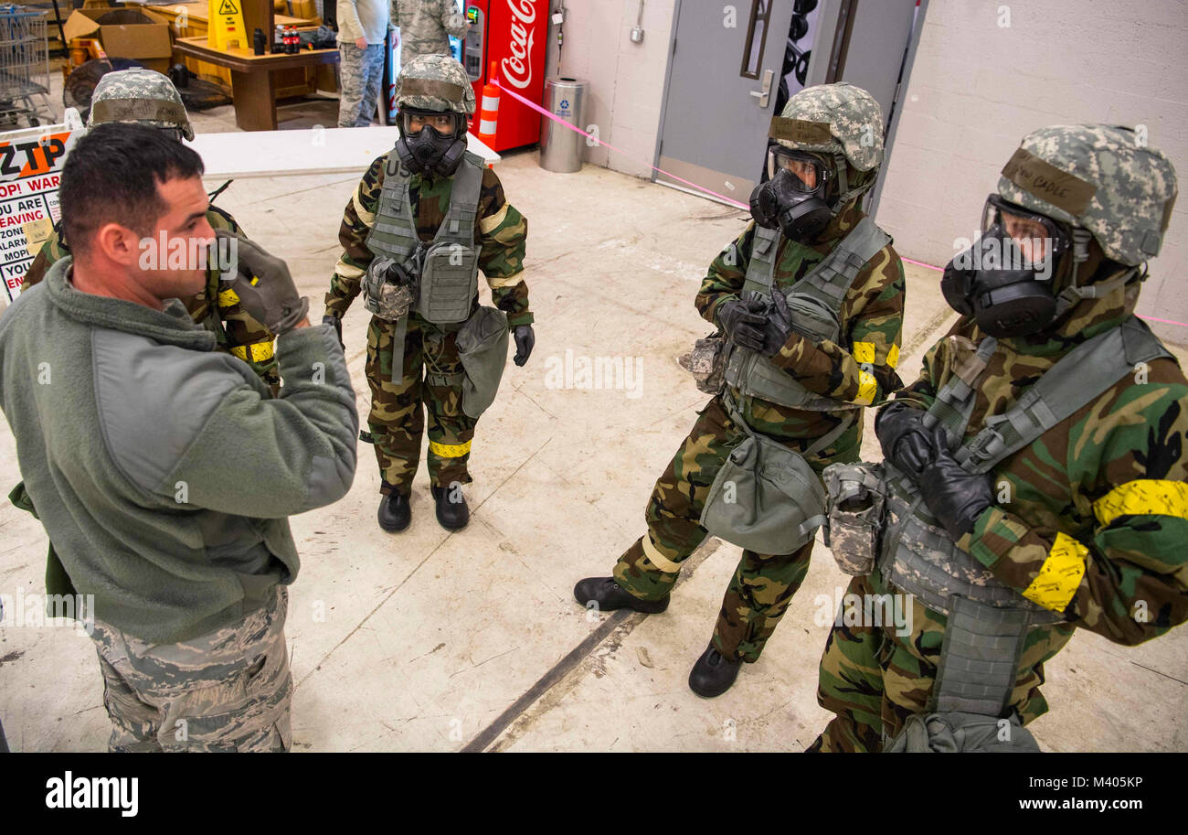 Tech. Sgt. Phillip Meeks explains the process of decontamination in the event of a chemical, biological, radiological, nuclear and explosives (CBRNE) attack during training Feb. 4, 2018 at McLaughlin Air National Guard Base, Charleston, West Virginia. 130th Airman trained in various disciplines over the drill weekend to improve their overall readiness in the event of an attack at home or abroad. (U.S. Air National Guard photo by Tech. Sgt. De-Juan Haley) Stock Photo