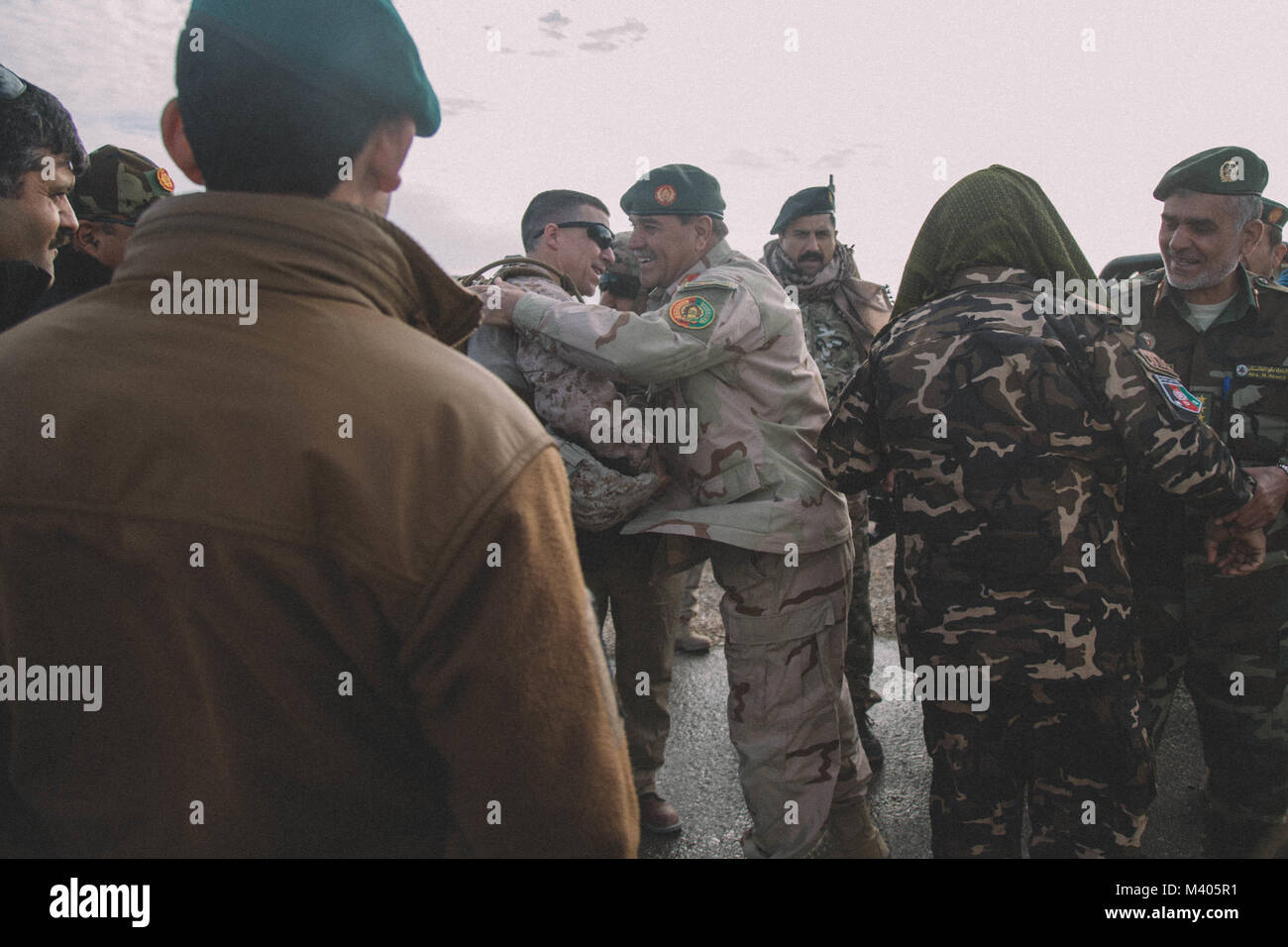 U.S. Marine Brig. Gen. Benjamin T. Watson, commanding general of Task Force Southwest (TFSW), is greeted by the leaders of Afghan National Army, 4th Brigade, 215th Corps at Camp Delaram, Afghanistan Feb. 5, 2018. Key leaders from TFSW and the ANDSF conducted a security shura to gain a greater understanding of the security situation through local elders from Nimroz province.   (U.S. Marine Corps photo by Sgt. Conner Robbins) Stock Photo