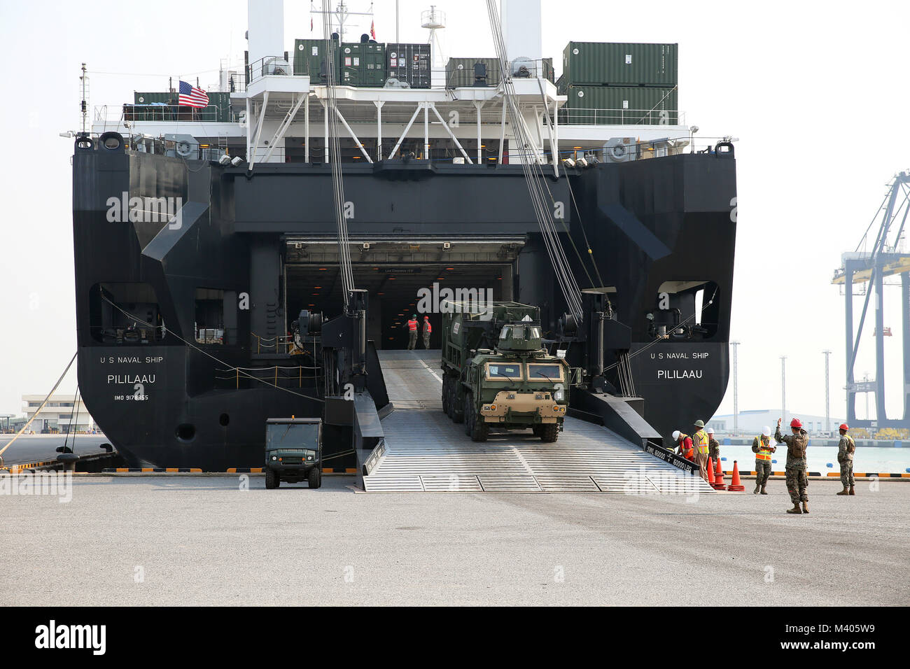 180206-N-IX266-006 LAEM CHABANG, Thailand— A military vehicle rolls off the ramp of Military Sealift Command’s (MSC) large, medium-speed, roll-on/roll-off ship USNS Pililaau (T-AK 304) during an offload at the port here to deliver equipment in support of Cobra Gold 2018, Feb. 5. The USNS Pililaau is part of Maritime Prepositioning Ships Squadron THREE, which consists of a fleet of government-owned ships operated by MSC and is based in the Guam-Saipan area of the Western Pacific Ocean. CG18 is a Thailand and United States co-sponsored exercise conducted annually in the Kingdom of Thailand. (U.S Stock Photo