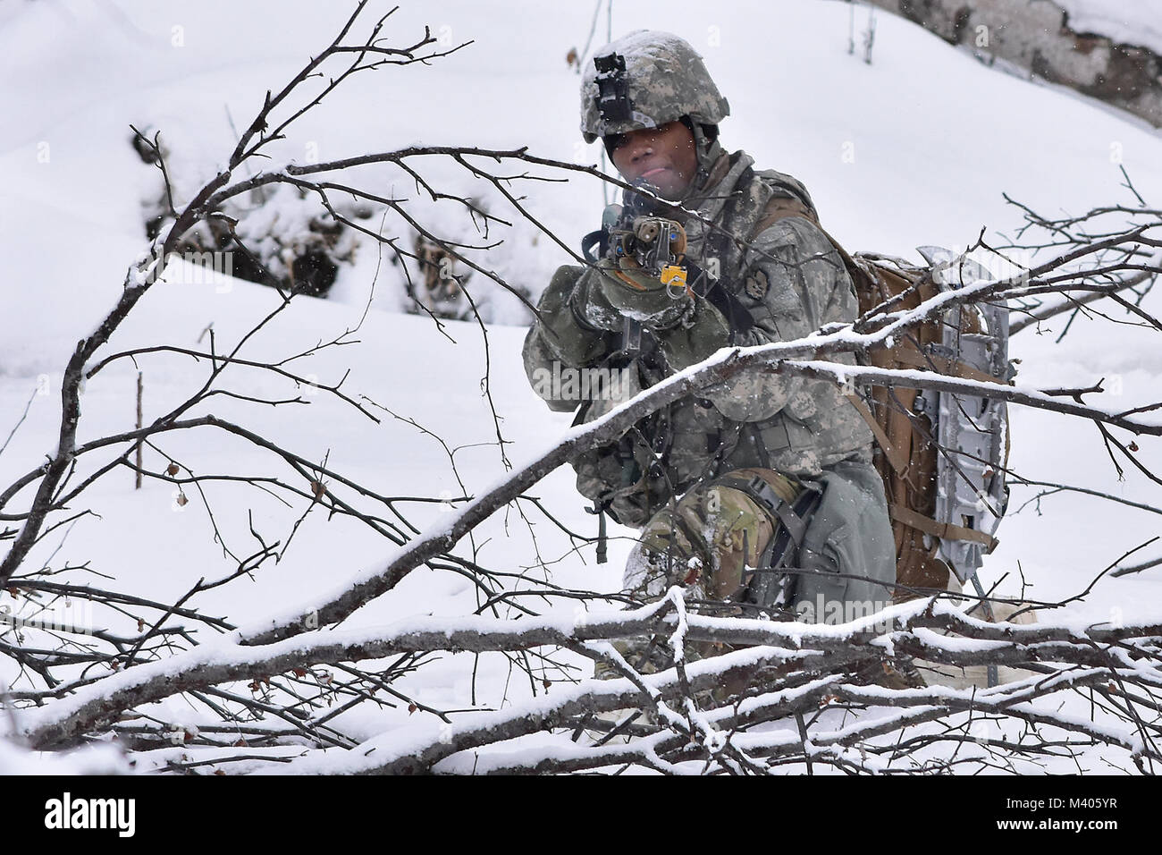 A Soldier from B Company, 1st Battalion, 5th Infantry Regiment, 1st Stryker Brigade Combat Team, 25th Infantry Division engages enemy forces during Operation Punchbowl, Feb. 6, 2018, at the multi-purpose training range on Joint Base Elmendorf-Richardson. A follow-on exercise to the short-notice deployment exercise Arctic Thrust, Punchbowl allowed 1-5 Infantry the opportunity to train for a battalion combined arms live-fire exercise on JBER ranges, nearly 350 miles from their home station at Fort Wainwright. (Army photo/John Pennell) Stock Photo