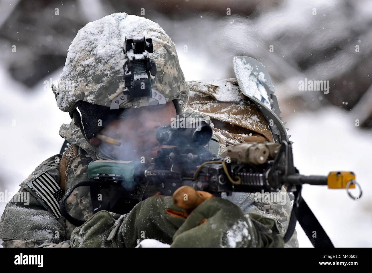 A Soldier from B Company, 1st Battalion, 5th Infantry Regiment, 1st Stryker Brigade Combat Team, 25th Infantry Division engages enemy forces during Operation Punchbowl, Feb. 6, 2018, at the multi-purpose training range on Joint Base Elmendorf-Richardson. A follow-on exercise to the short-notice deployment exercise Arctic Thrust, Punchbowl allowed 1-5 Infantry the opportunity to train for a battalion combined arms live-fire exercise on JBER ranges, nearly 350 miles from their home station at Fort Wainwright. (Army photo/John Pennell) Stock Photo