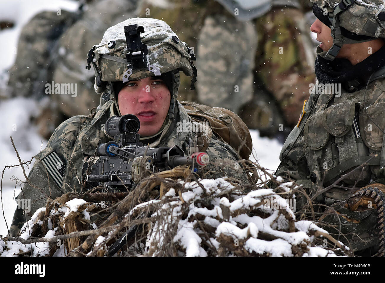 Pfc. Noah Wingad, B Company, 1st Battalion, 5th Infantry Regiment, 1st Stryker Brigade Combat Team, 25th Infantry Division, provides security during Operation Punchbowl, Feb. 6, 2018, at the multi-purpose training range on Joint Base Elmendorf-Richardson. A follow-on exercise to the short-notice deployment exercise Arctic Thrust, Punchbowl allowed 1-5 Infantry the opportunity to train for a battalion combined arms live-fire exercise on JBER ranges, nearly 350 miles from their home station at Fort Wainwright. (Army photo/John Pennell) Stock Photo