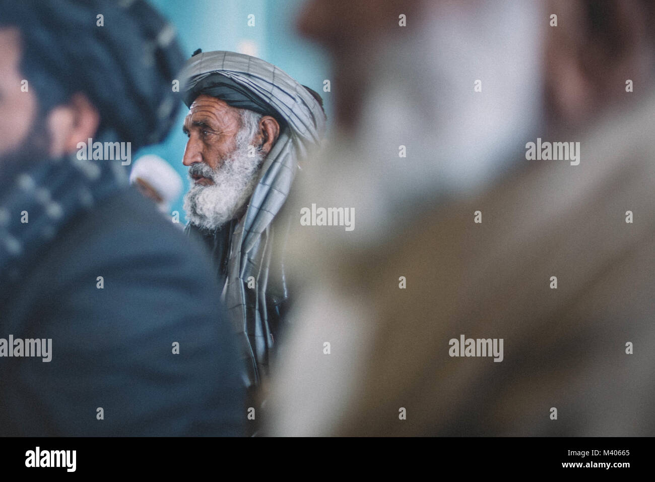 Local elders from Delaram listen during a security shura with leaders from Task Force Southwest (TFSW) and the Afghan National Defense and Security Force (ANDSF) at Camp Delaram, Afghanistan Feb. 5, 2018. Key leaders from TFSW and the ANDSF conducted a security shura to gain a greater understanding of the security situation through local elders from Nimroz province.  (U.S. Marine Corps photo by Sgt. Conner Robbins) Stock Photo