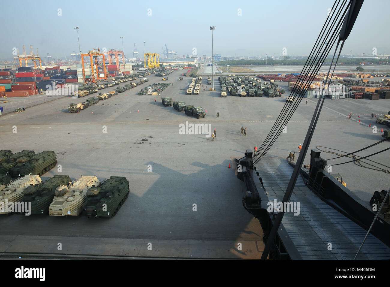 180206-N-IX266-010 LAEM CHABANG, Thailand—Military vehicles are staged at the port here during an offload of Military Sealift Command’s (MSC) large, medium-speed, roll-on/roll-off ship USNS Pililaau (T-AK 304) in support of Cobra Gold 2018 (CG18), Feb. 5. The USNS Pililaau is part of Maritime Prepositioning Ships Squadron THREE, which consists of a fleet of government-owned ships operated by MSC and is based in the Guam-Saipan area of the Western Pacific Ocean. CG18 is a Thailand and United States co-sponsored exercise conducted annually in the Kingdom of Thailand. (U.S. Navy photo by Grady T. Stock Photo