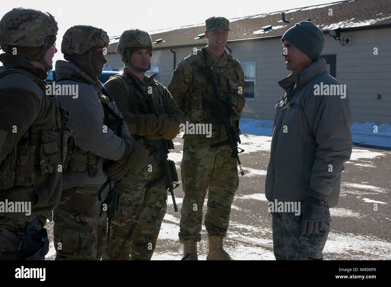 Brig. Gen. Paul Tibbets IV, Air Force Global Strike Command deputy commander, speaks with 91st Security Forces Group Airmen at a missile alert facility near Mohall, N.D., Feb. 7, 2018. During the interaction, Tibbets discussed upgrades to security forces vehicles, weaponry and other protective gear. (U.S Air Force photo by Staff Sgt. Sahara L. Fales) Stock Photo