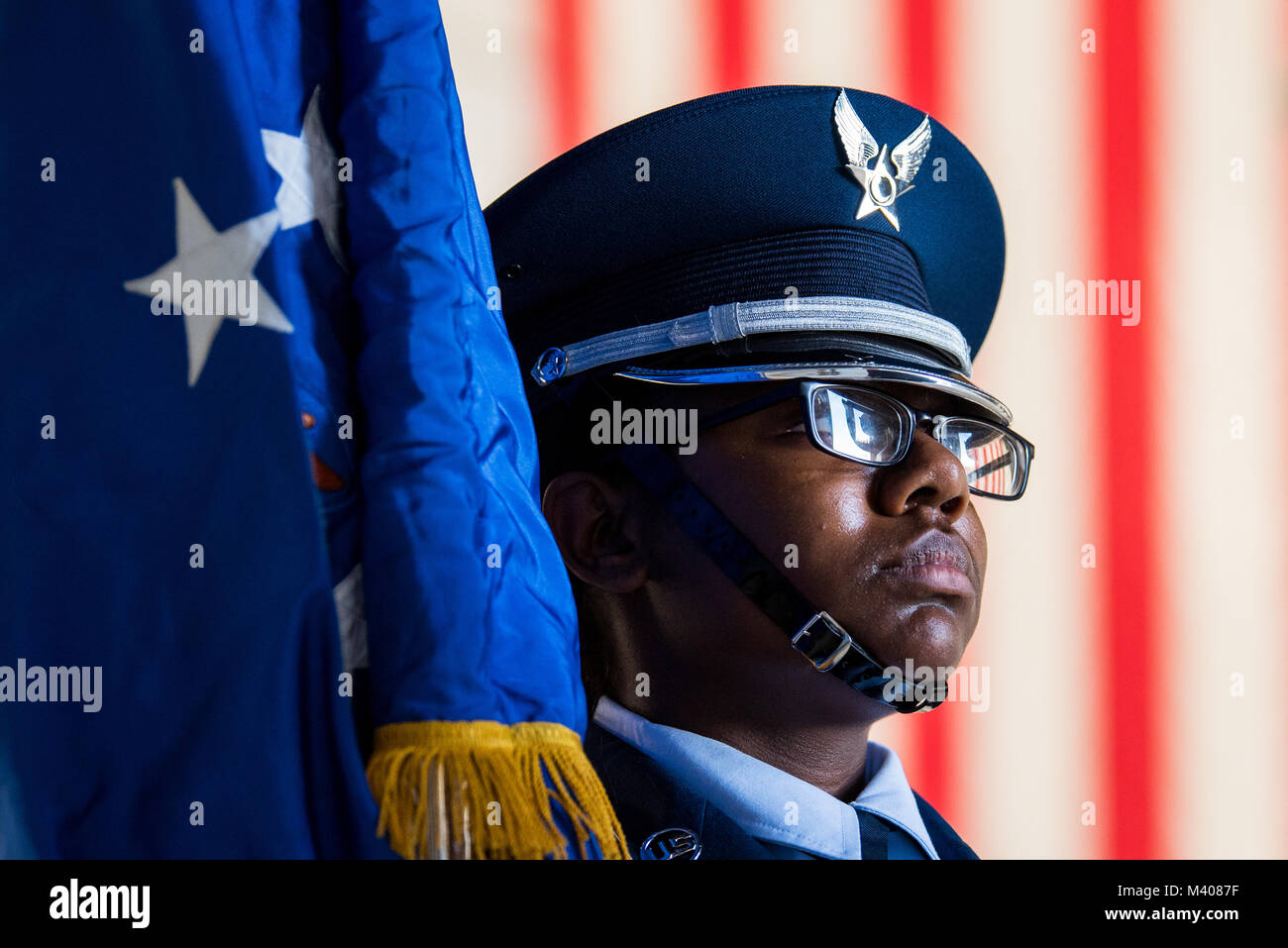 Airman 1st Class Myshanique Jones a member of the Travis Air Force Base Honor Guard holds the Air Force flag during the 75th Anniversary kickoff celebration at Travis AFB, Calif., Feb. 8, 2018. The celebration featured the inaugural unveiling of the 75th Anniversary logo on a C-17 Globemaster III. Travis is celebrating 75 years as a major strategic logistics hub for the Pacific and integral part of global power projection for the total force. (U.S. Air Force photo by Master Sgt. Joey Swafford) Stock Photo