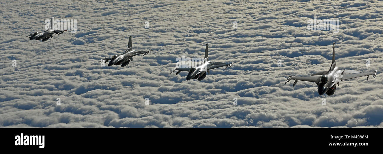Four U.S. Air Force F-16C Fighting Falcons fly in formation during air refueling training in Swedish airspace, Feb. 8, 2018. The training was in conjunction with a rotational deployment of F-16Cs from the Ohio Air National Guard’s 180th Fighter Wing to Amari Air Base, Estonia, as part of a Theater Security Package. (U.S. Air Force photo by Airman 1st Class Luke Milano) Stock Photo