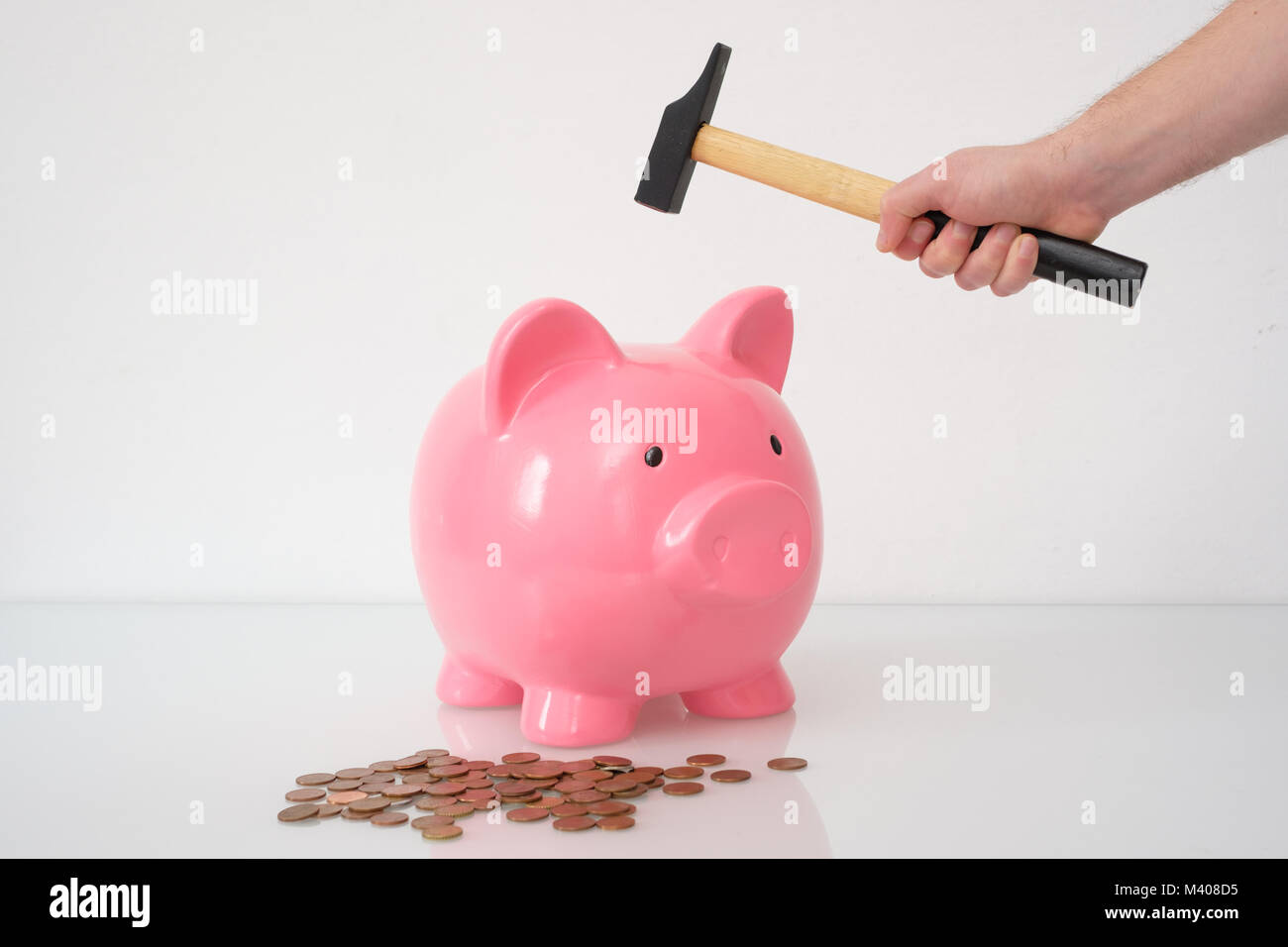 Hammer about to smash a piggy bank isolated on white background Stock ...