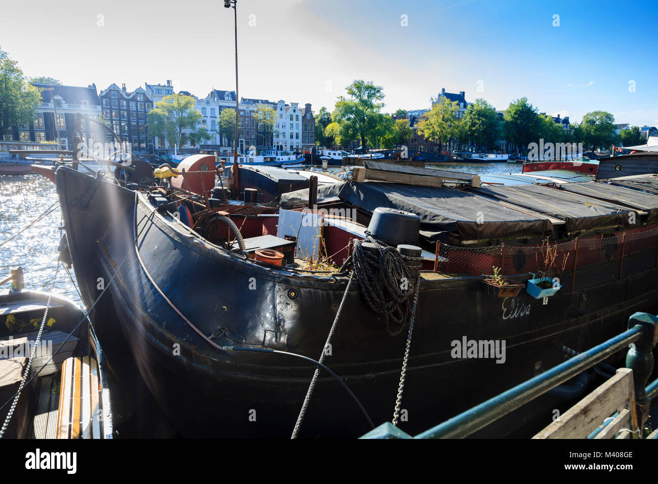 The Elisa, a barge moored on the Amstel in Amsterdam Stock Photo