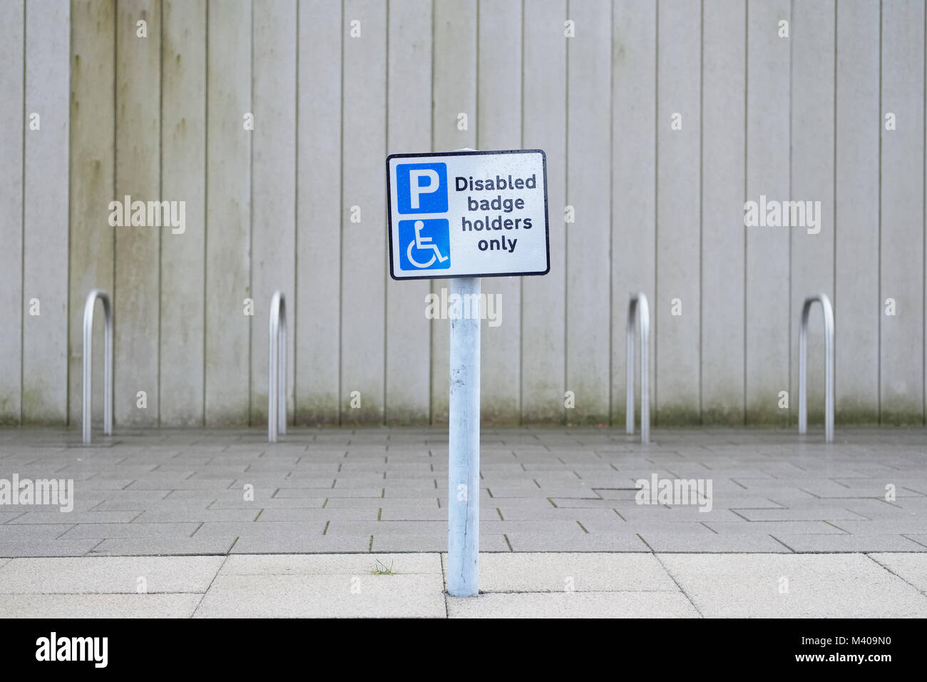 Disabled badge holders only sign at car park in public shipping centre