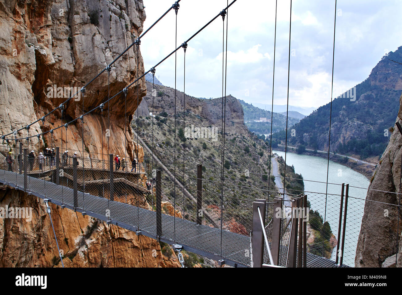 The suspension bridge of El Caminito del Rey - people crossing the ...
