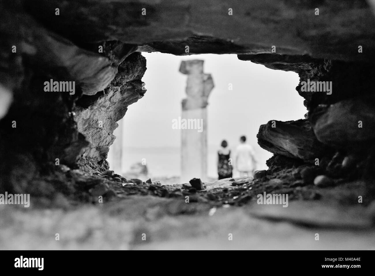 SIRMIONE, ITALY, Juli 2014. Two Tourist People (unrecognizable man and woman) Standing in Grottoes of Catullus. Black and White Photo. Stock Photo