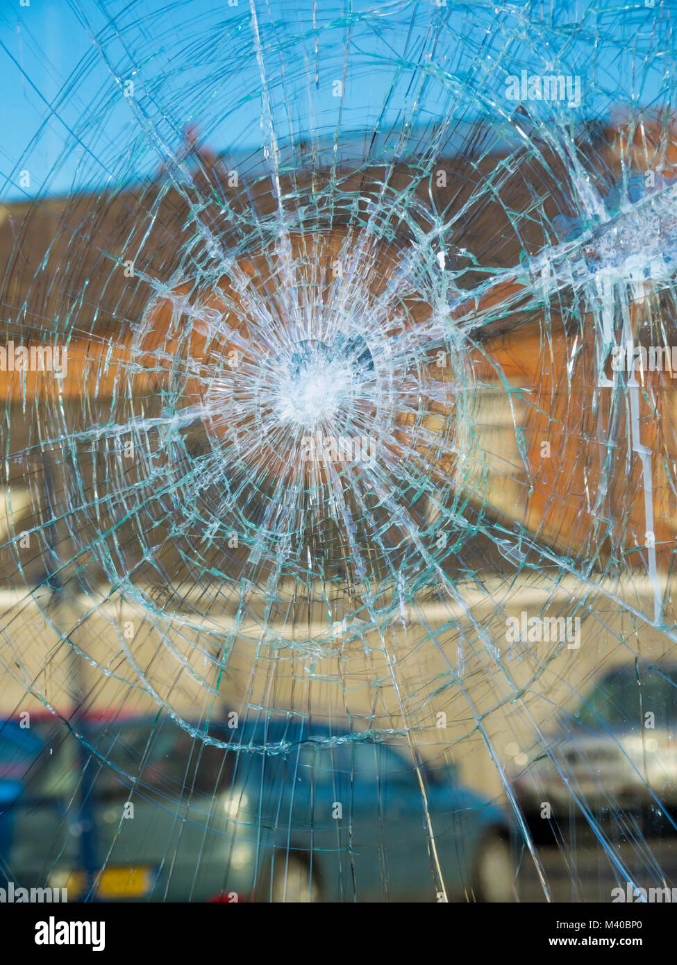 Criminal damage a shop window broken by vandals Stock Photo