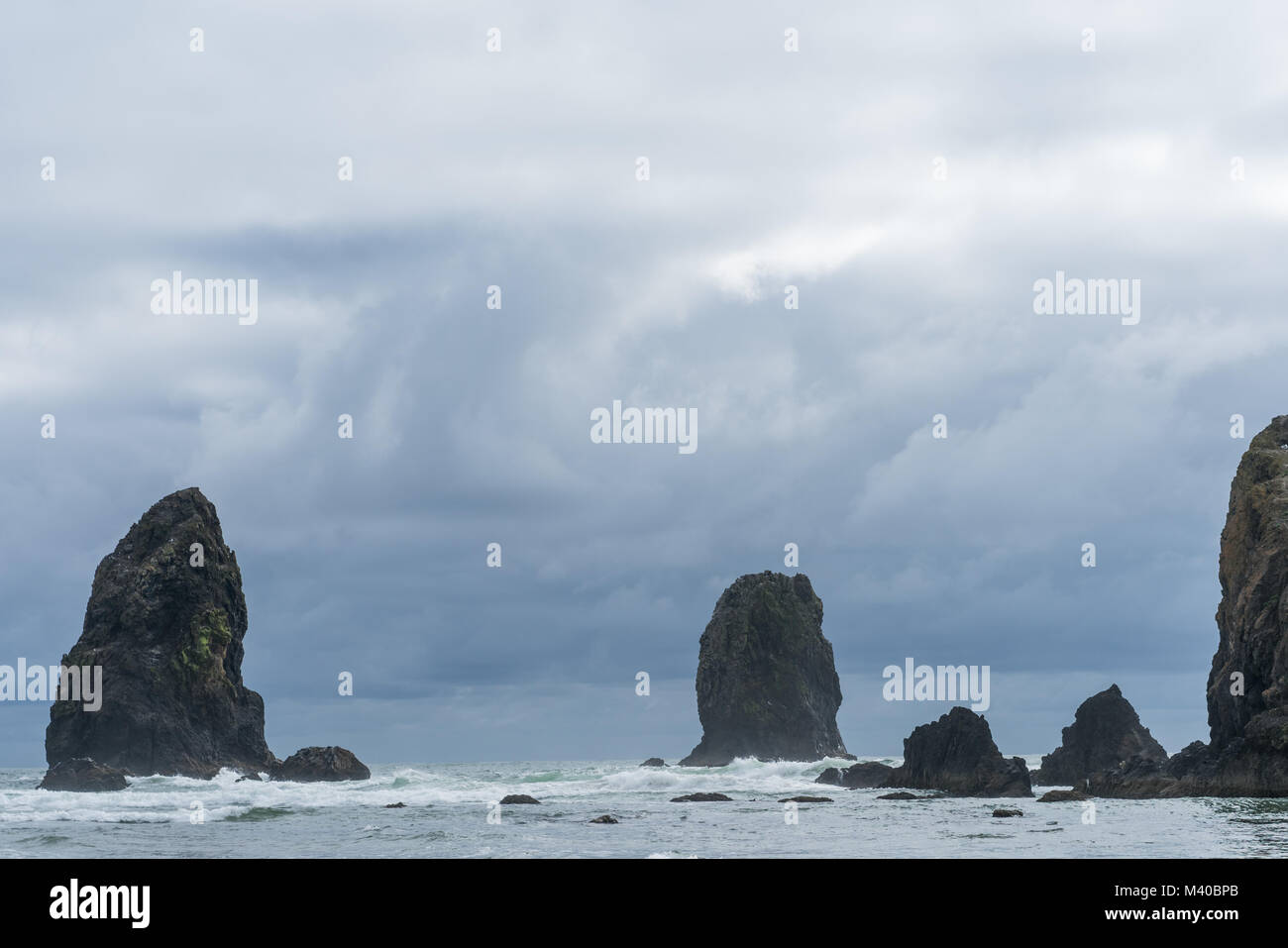 The Rocky Outcroppings of Cannon Beach, Oregon on the pacific northwest coast. Featured in a scene of the popular movie 'The Goonies' Stock Photo