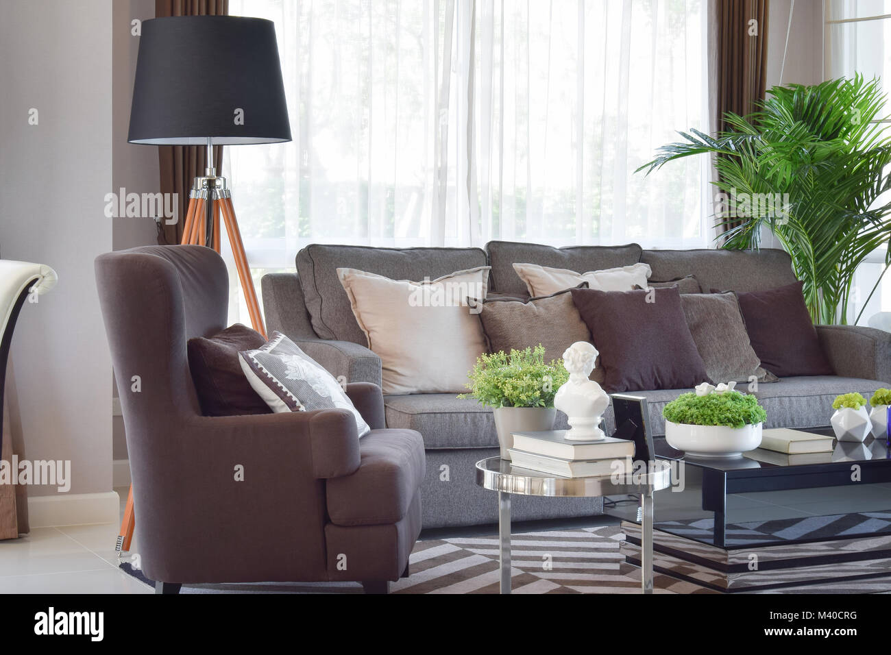 modern living room design with sofa and wooden lamp Stock Photo - Alamy