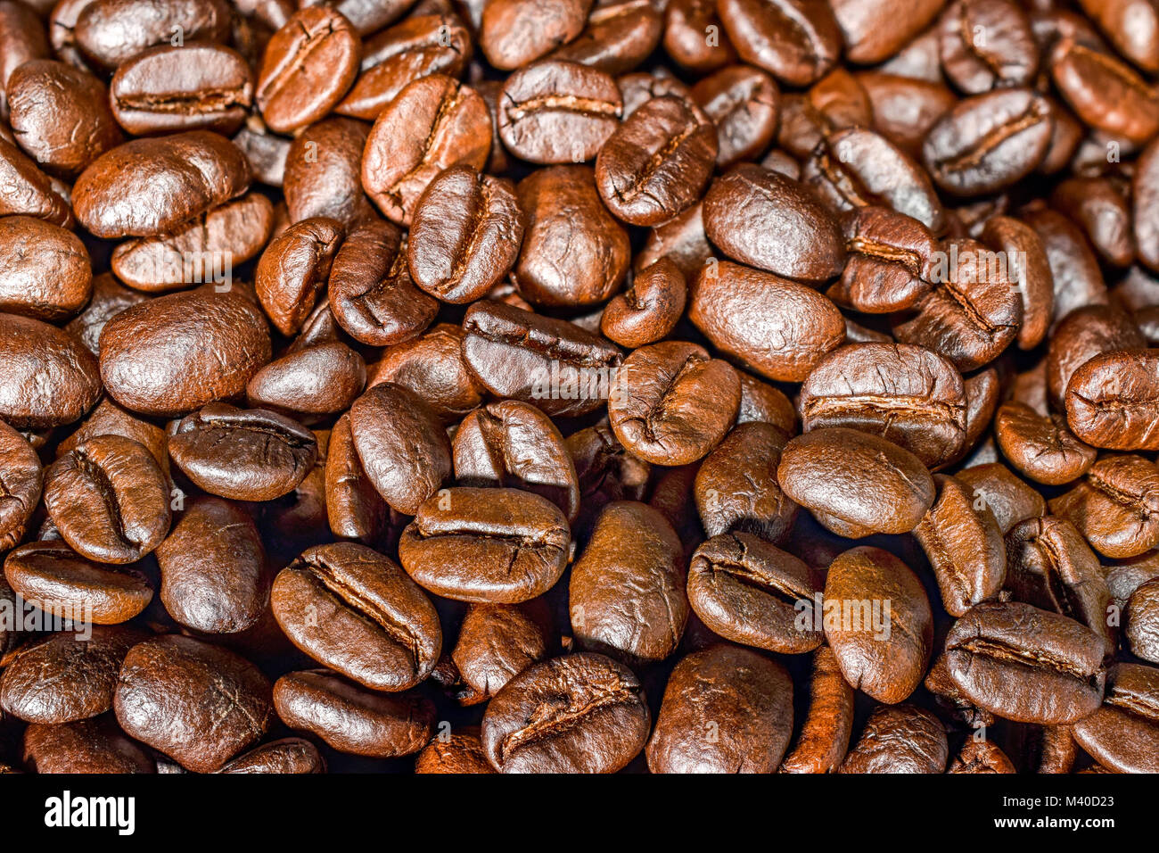 Close-up of coffee beans background Stock Photo - Alamy