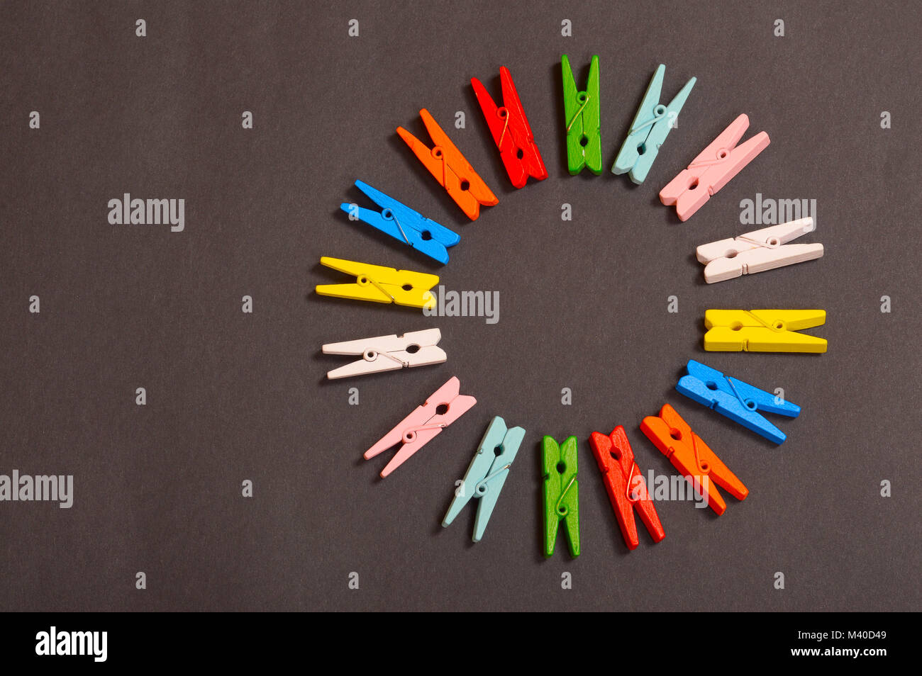 Circle of colorful clothespins Stock Photo