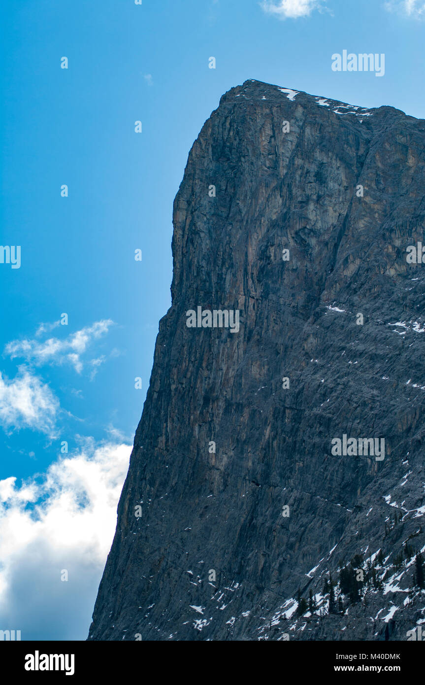 Ha Ling Peak against a blue sky in the Rocky Mountains west of Canmore, Alberta, Canada, vertical orientation Stock Photo
