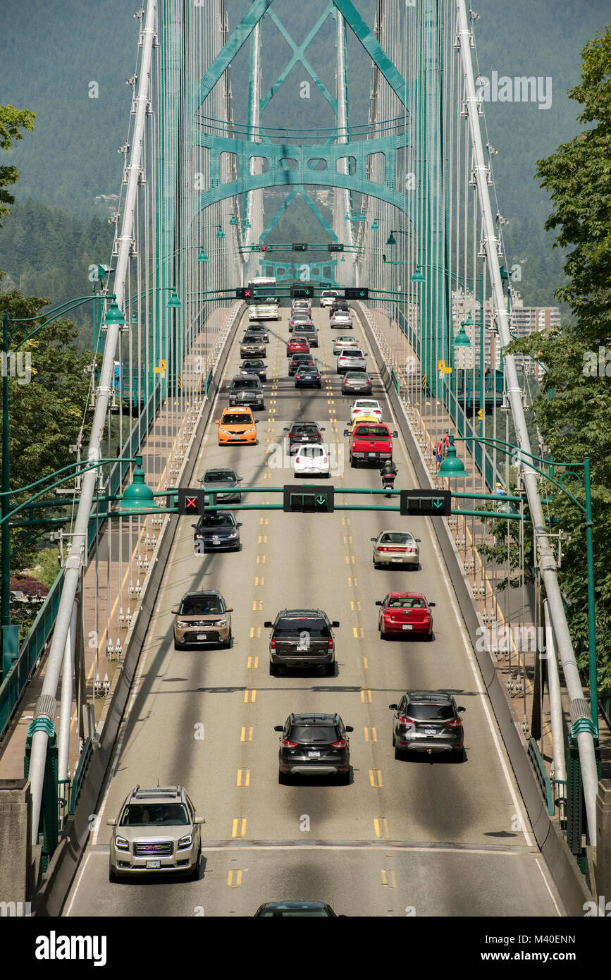 Vancouver, British Columbia, Canada.  Traffic on Lions Gate Bridge at north end of Stanley Park, vertical orientation. Stock Photo