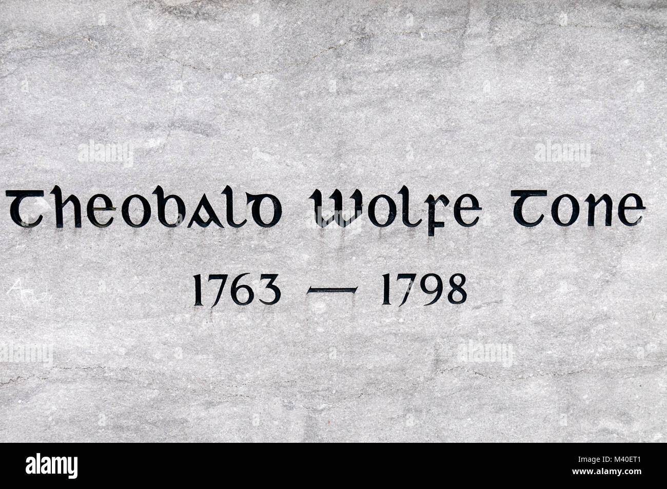 A plaque attached to the statue of  Theobald Wolfe Tone.1763- 1798.   He  was an Irish revolutionary figure and his statue stands  in WolfeTone Square Stock Photo