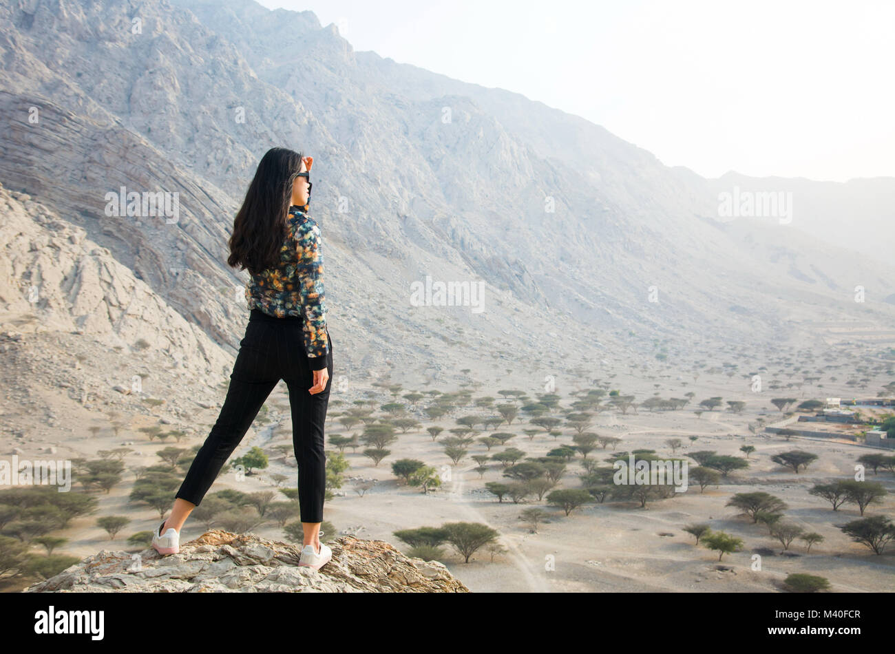 Girl enjoying scenery on a desert hiking trip Stock Photo