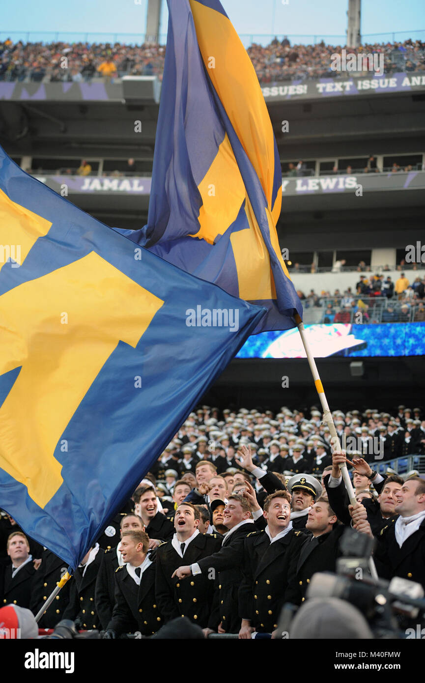 141213-D-FW736-043 --U.S. Naval Academy midshipmen rally behind their team during the 115th Army-Navy football game at M&T Bank Stadium in Baltimore, Md., Dec. 13. The Navy won 17-10, extending their winning streak against Army for the 13th straight year. (Department of Defense photo by Marv Lynchard) 141213-D-FW736-043 by DoD News Photos Stock Photo