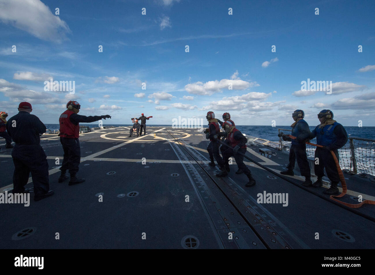 150131-N-ZE250-021 ATLANTIC OCEAN (Jan.31, 2015) - Sailors aboard Arleigh-Burke Class Guided Missile Destroyer USS Jason Dunham (DDG-109) conduct an aircraft firefighting drill on the flight deck while on deployment Jan. 31. USS Jason Dunham is currently underway in support of Operation Martillo, a joint operation with the U.S. Coast Guard and partner nations, within the 4th Fleet area of responsibility. (U.S. Navy photo by Mass Communication Specialist 3rd Class Weston Jones / Released) 150131-N-ZE250-021 by U.S. Naval Forces Southern Command  U.S. 4th Fleet Stock Photo