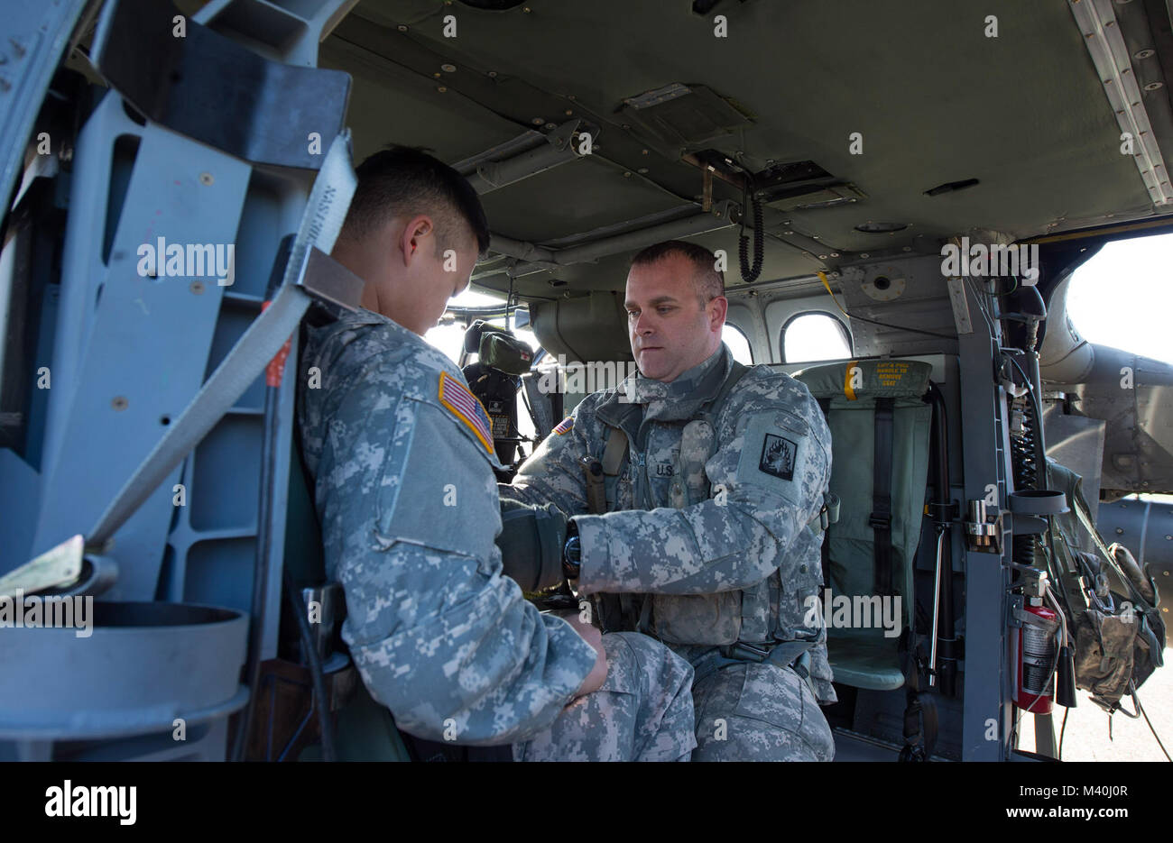U.S. Army Staff Sergeant Jay Wicklin, a flight medic with the 1-214th ...