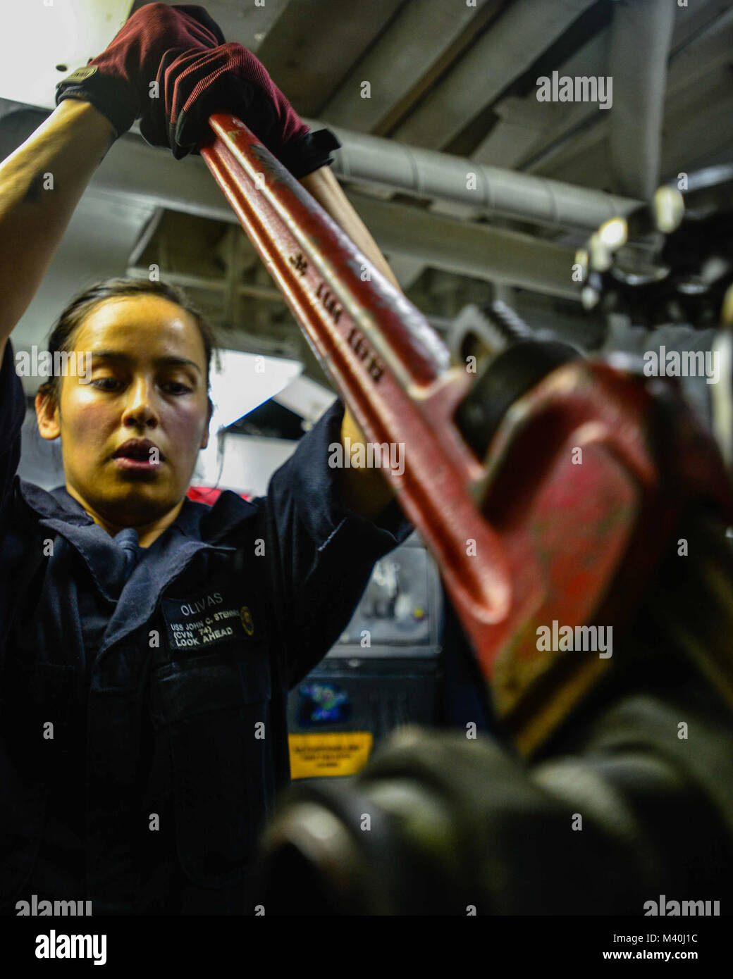 150420-N-TC437-128 PACIFIC OCEAN (April 20, 2015) - Machinist's Mate Fireman Veronica Olivas, from Pueblo, Colo., loosens a coupling on a steam valve aboard USS John C. Stennis (CVN 74). Stennis is undergoing Tailored Ship's Training Availability and Final Evaluation Problem, assessing its abilities to conduct combat missions, support functions and survive complex casualty control situations. (U.S. Navy Photo by Mass Communication Specialist 3rd Class Ignacio D. Perez/ Released) 150420-N-TC437-128 by USS John C. Stennis (CVN 74) Official Stock Photo