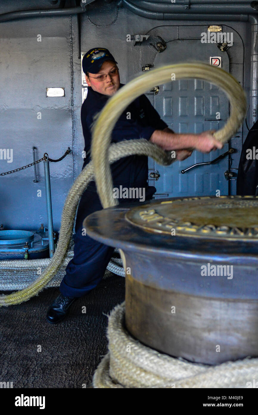 150504-N-TC437-075 NORTH ISLAND, Calif. (May 4, 2015) - Boatswain's Mate Seaman Jaymz Culver, from Mounds View, Minn., removes a line from a capstan on USS John C. Stennis' fantail. The ships comprising the John C. Stennis Strike Group (JCSSG) are participating in a Group Sail exercise designed to develop coordinated capabilities. (U.S. Navy Photo by Mass Communication Specialist 3rd Class Ignacio D. Perez/ Released) 150504-N-TC437-075 by USS John C. Stennis (CVN 74) Official Stock Photo