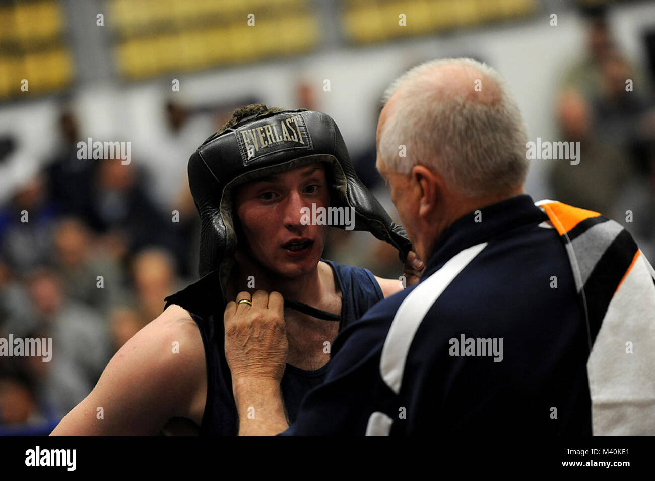 U S Air Force Academy Boxing Coach Edward Weichers Fastens Cadet Second Class Glenn Miltenberg Head Gear During His Bout Against U S Army West Point Cadet Sebastian Mimms On November 4 11at The