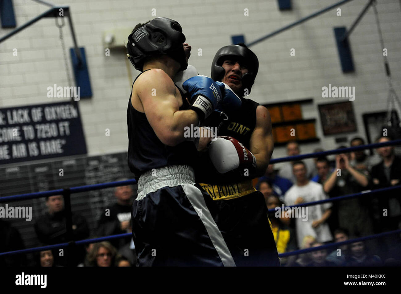 U.S. Air Force Academy Cadet First Class Mike McLain boxes U.S. Army West Point Cadet Ceon Harris on November 4, 2011at the Air Force Academy, Colorado Springs, Colorado. Cadet First Class Mike McLain ended up winning his bout. The Army cadets ended up winning the overall competition taking five of the eight bouts.(U.S. Air Force Photo by: MSgt Jeremy Lock) (Released) 111104-F-JQ435-015 by AirmanMagazine Stock Photo