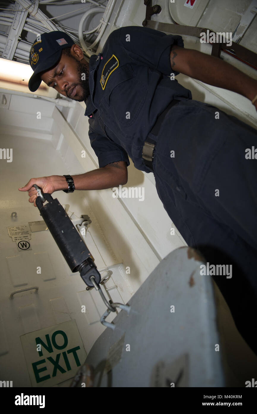 150518-N-IG780-006 PACIFIC OCEAN (May 18, 2015) — Yeoman 3rd Class Cody Charles performs regularly scheduled maintenance on a hatch on board guided-missile frigate USS Kauffman (FFG 59). Kauffman is currently underway in support of Operation Martillo, a joint operation with the U.S. Coast Guard and partner nations within the 4th Fleet area of responsibility. (U.S. Navy photo by Mass Communication Specialist 3rd Class Shane A. Jackson/Released) 150518-N-IG780-006 by U.S. Naval Forces Southern Command  U.S. 4th Fleet Stock Photo
