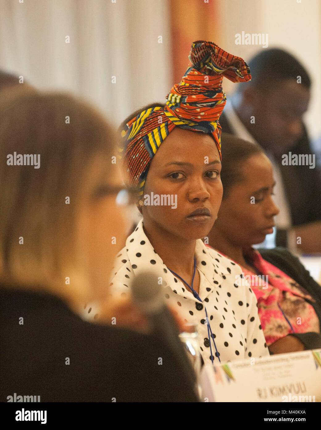 Ms. Saumu Mwanyoka (center), a member of the Tanzanian Peoples Defense Force, participates the 2015 Gender Mainstreaming Seminar in Arusha, Tanzania on May 21. United States Army Africa (USARAF) co-hosted the conference, along side the Tanzanian Peoples Defense Force, in an effort to frame the importance of gender mainstreaming and promote equality throughout the region. (DoD News photo by Staff Sgt. Brian Kimball) 150521-F-QP401-063 by DoD News Photos Stock Photo