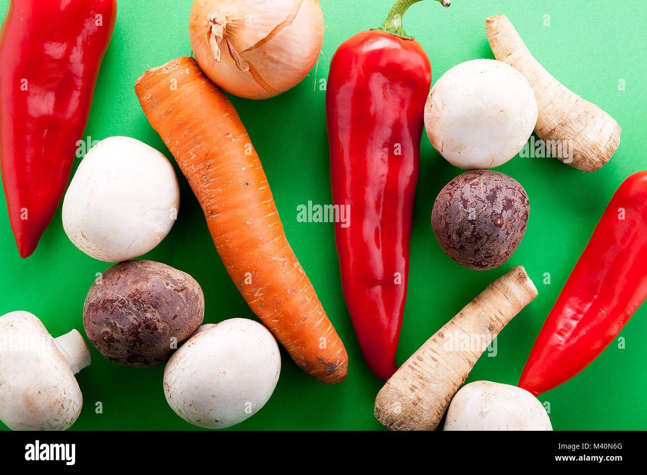 Top view of vegetables on green background Stock Photo - Alamy