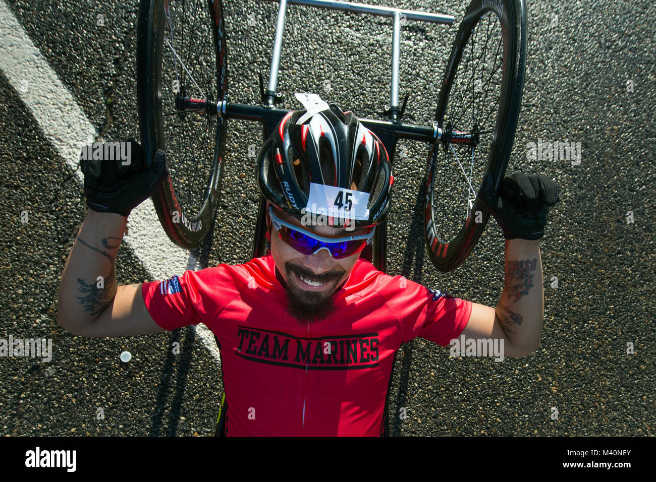 Marine Corps Team’s Ronnie Jimenez awaits the start of bicycle racing for the 2015 Department of Defense Warrior Games at Marine Corps Base Quantico June 21, 2015. Jimenez won gold in the Men’s H5 Hand Cycle Division. (DoD News photo by EJ Hersom) 150621-D-DB155-006 by DoD News Photos Stock Photo