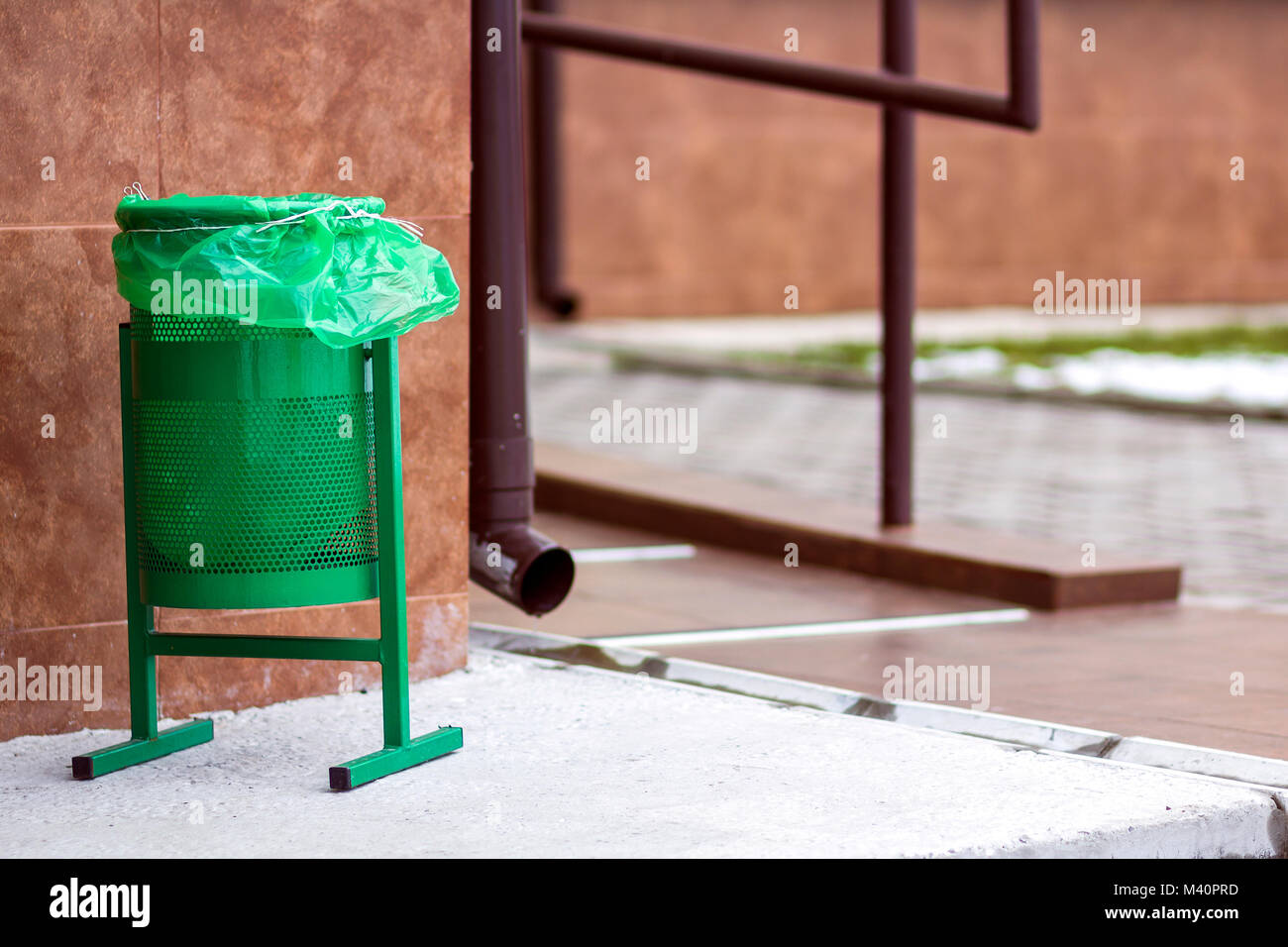 Metal green gerbage bin for rubbish. Public trash can background ...