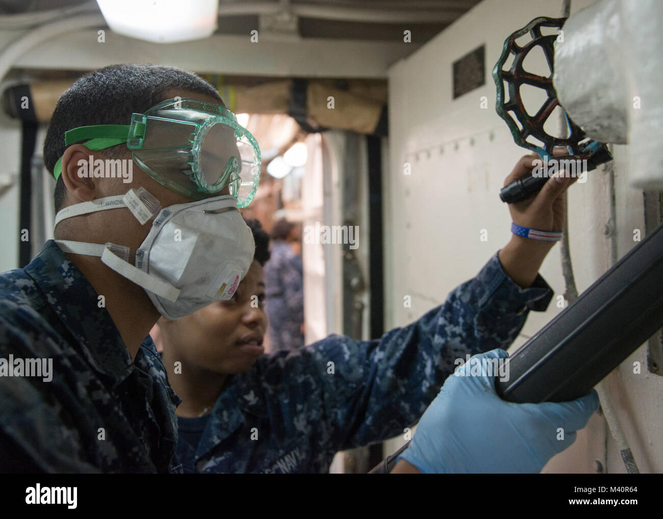 150709-N-IK337-002 BREMERTON, Wash. (July 9, 2015) - Culinary Specialist Seaman Kenneth Rorie, from Greensborough, N.C., and Culinary Specialist 3rd Class Jamillah Williams, from Forrest, Miss., perform maintenance on a fan coil unit aboard USS John C. Stennis (CVN 74). The crew is currently preparing for the Navy's Board of Inspection and Survey (INSURV).  (U.S. Navy photo by Mass Communication Specialist 3rd Class Christopher Frost / Released) 150709-N-IK337-002 by USS John C. Stennis (CVN 74) Official Stock Photo