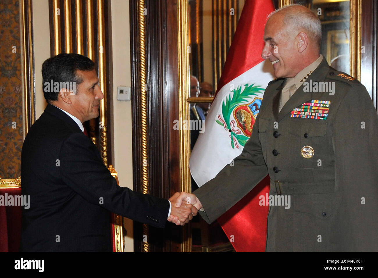 LIMA, Peru (Jan. 22, 2013) -- U.S. Marine Gen. John Kelly, commander of U.S. Southern Command, is greeted by Peruvian President Ollanta Humala.  Kelly was in Peru Jan. 21 - 23 to meet with senior defense and government officials to discuss shared security concerns and cooperation.  (Photo courtesy of Presidential Palace, Peru) 130122-A-BS728-001 by ussouthcom Stock Photo