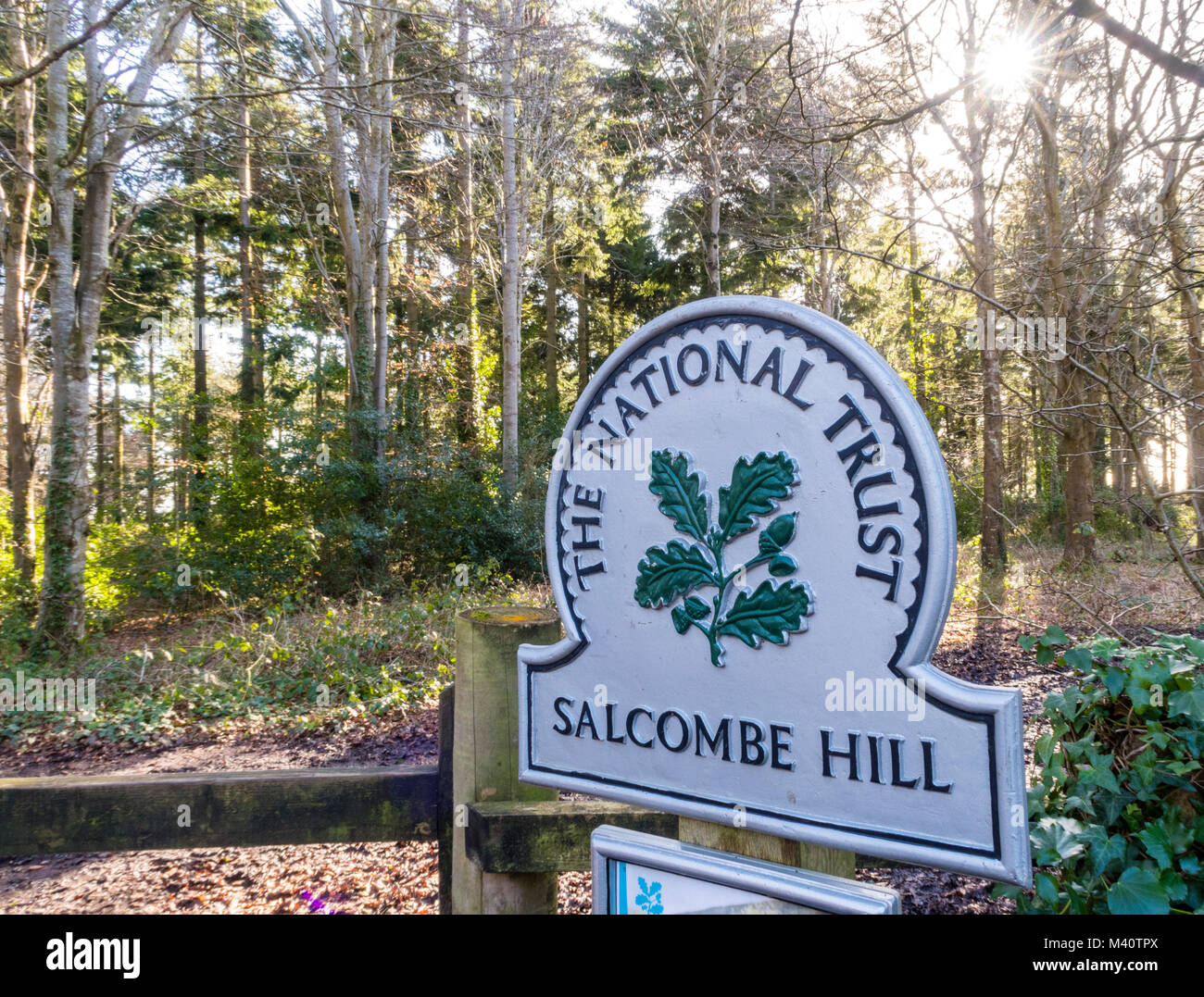 National Trust sign on the roadside at the entrance to woodland on Salcombe Hill, near Sidmouth, Devon. Stock Photo