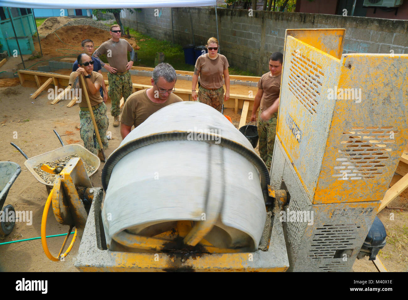 150902-A-ZA034-051 PUERTO CASTILLA, Honduras (Sept. 2, 2015) Sailors assigned to Construction Battalion Maintenance Unit 202 and Military Sealift Command hospital ship USNS Comfort (T-AH 20), mix cement at an engineering site established at The Centro Basico 14 de Agosto Lugar Puerto Castilla School during Continuing Promise 2015. Continuing Promise is a U.S. Southern Command-sponsored and U.S. Naval Forces Southern Command/U.S. 4th Fleet-conducted deployment to conduct civil-military operations including humanitarian-civil assistance, subject matter expert exchanges, medical, dental, veterina Stock Photo