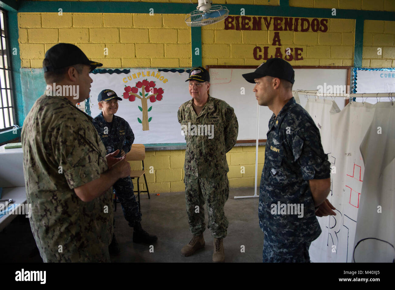 150904-N-KG407-146 COROCITO, Honduras (Sept. 4, 2015) Capt. Sam Hancock, left, Continuing Promise 2015 mission commander, speaks with Rear Adm. George Ballance, Commander, U.S. Naval Forces Southern Command/ U.S. 4th Fleet, center, during a tour of a medical site established at Centro de Educacion Basica Dr. Jesus Aquilar Paz in support of Continuing Promise 2015. Continuing Promise is a U.S. Southern Command-sponsored and U.S. Naval Forces Southern Command/U.S. 4th Fleet-conducted deployment to conduct civil-military operations including humanitarian-civil assistance, subject matter expert ex Stock Photo